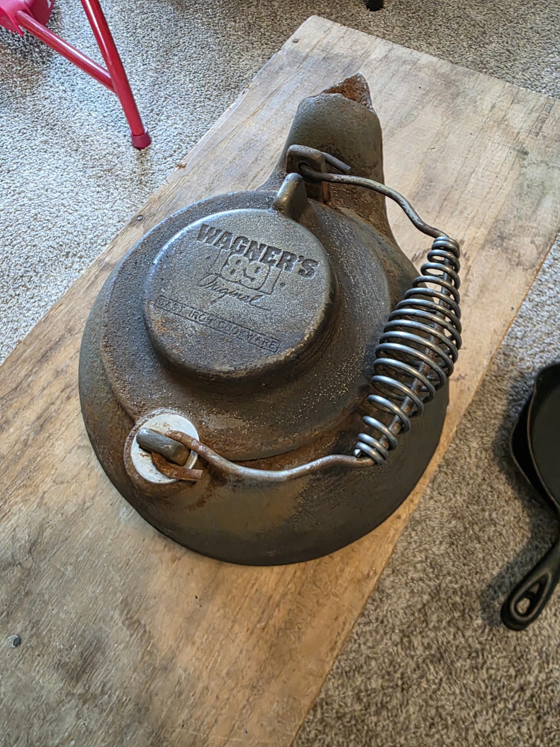 Wagner's 1891 Original cast-iron tea kettle with rust and residue